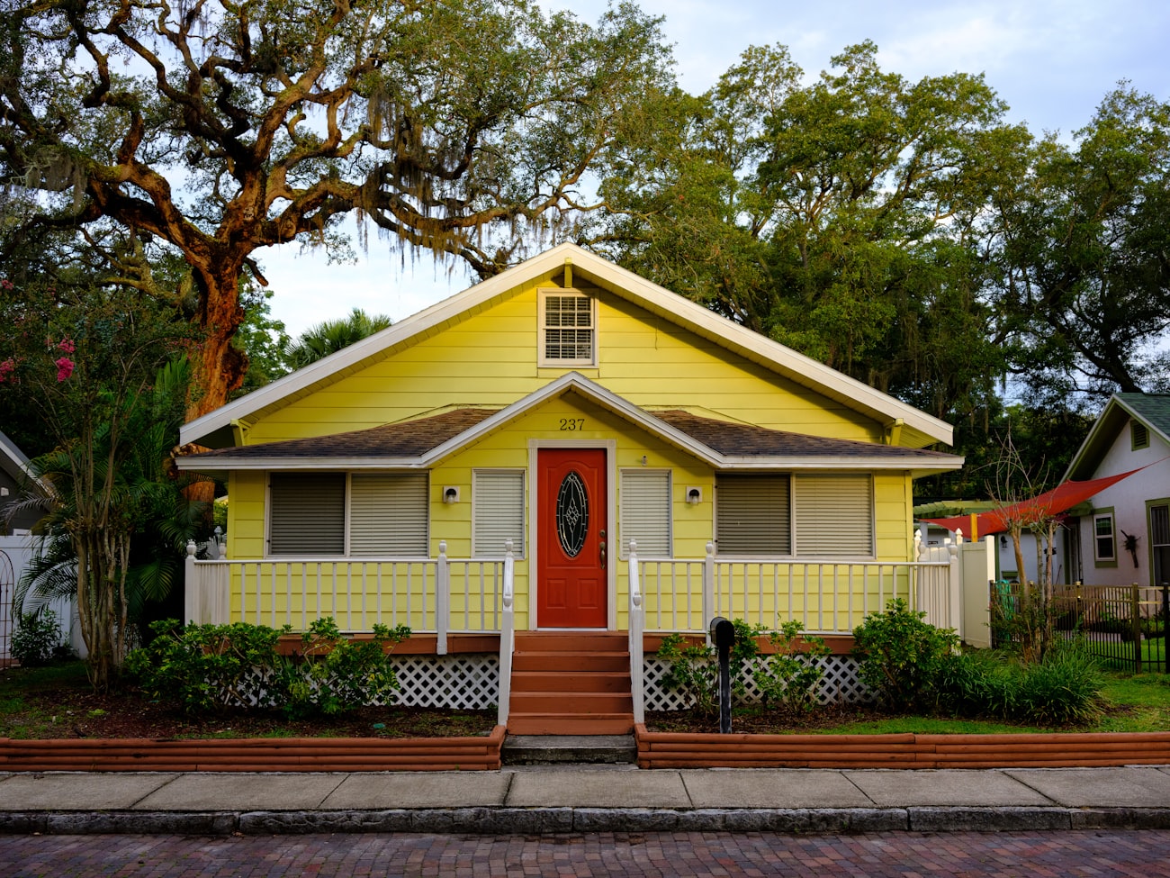 A classic old-Florida bungalow on a brick-paved street